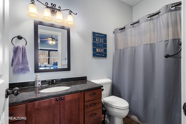 full bathroom with curtained shower, vanity, and toilet