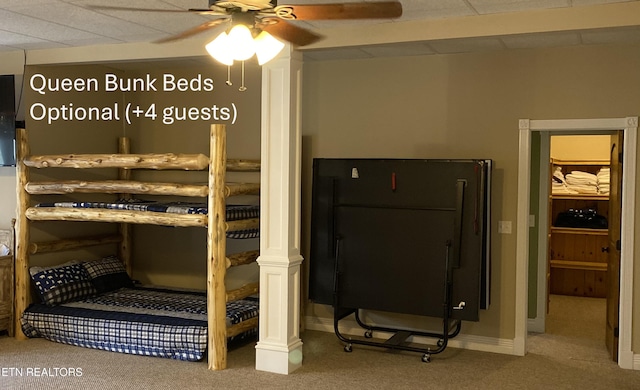 carpeted bedroom featuring baseboards