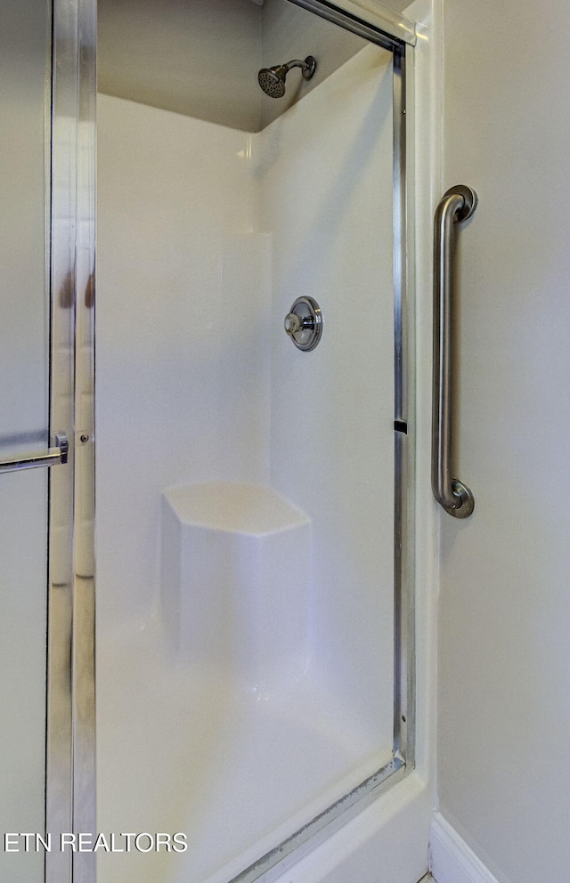 bathroom with a stall shower