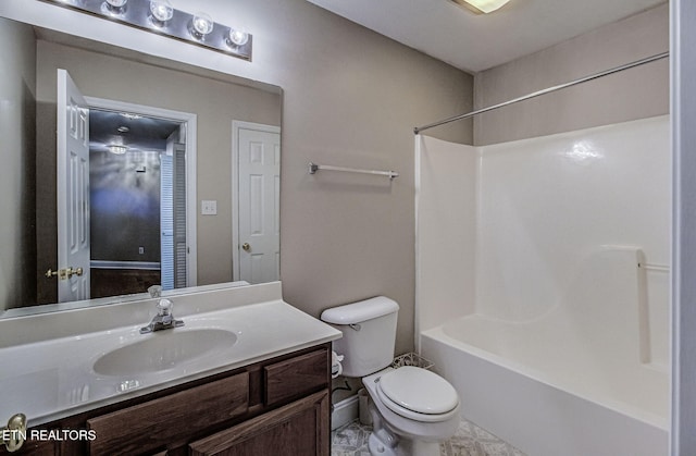 full bath with shower / tub combination, vanity, and toilet