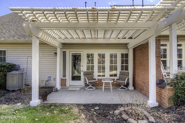 view of patio / terrace with central air condition unit and a pergola