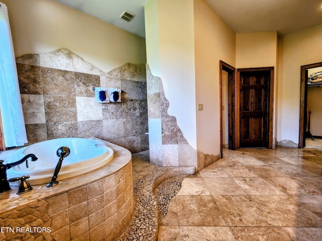 full bath featuring visible vents and a bath