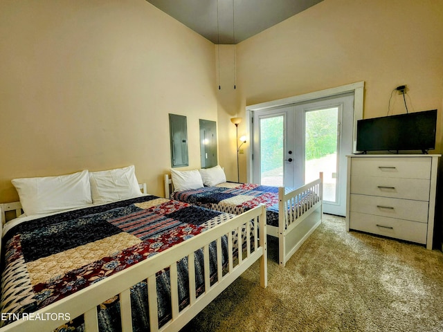 carpeted bedroom featuring access to outside, french doors, and electric panel