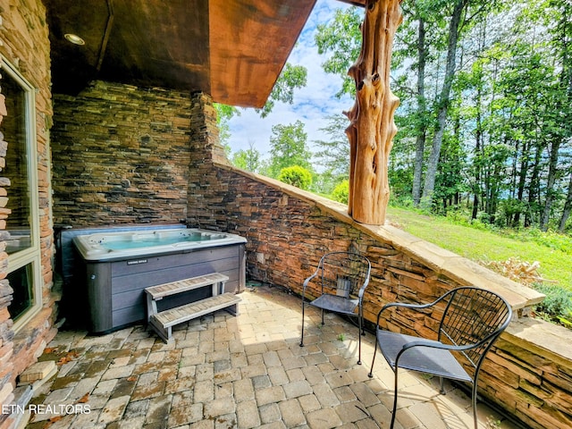 view of patio featuring a hot tub