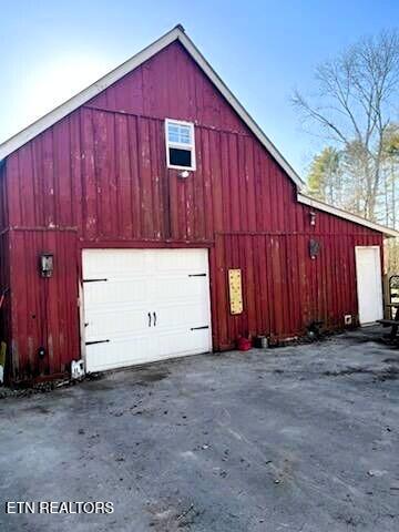 detached garage featuring driveway