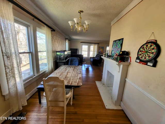 dining room featuring crown molding and hardwood / wood-style flooring