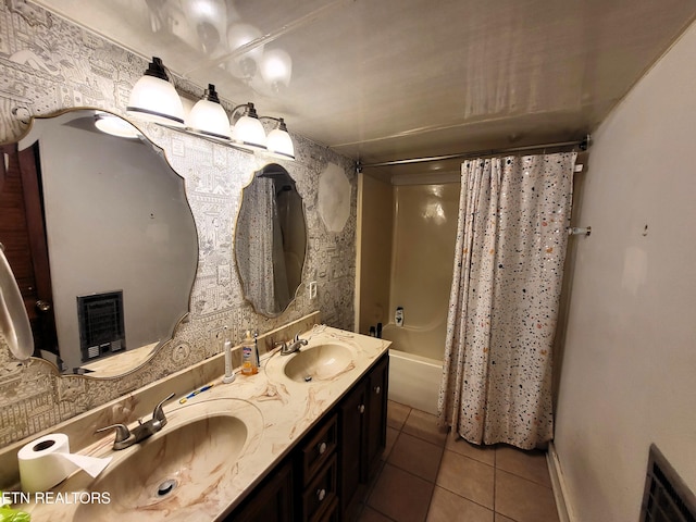 bathroom featuring shower / bath combo, double vanity, tile patterned flooring, and a sink