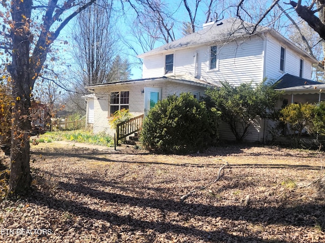 view of property exterior with brick siding