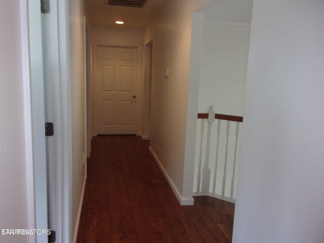 hallway with dark wood-type flooring, recessed lighting, an upstairs landing, and baseboards