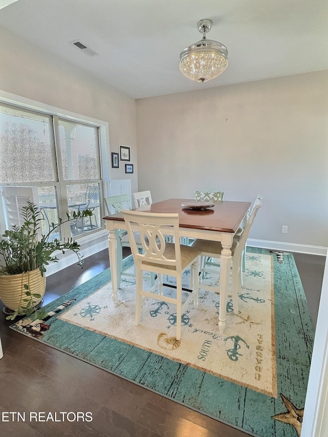 dining space featuring visible vents and baseboards