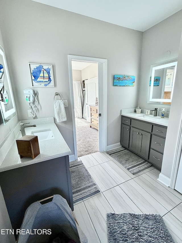 bathroom featuring vanity and baseboards