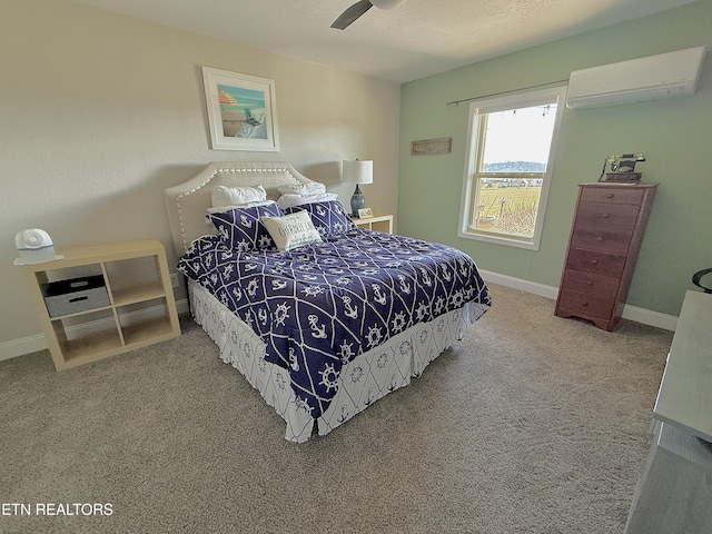 carpeted bedroom with a textured ceiling, an AC wall unit, and baseboards