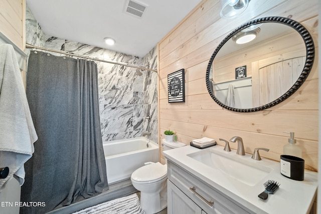 bathroom with toilet, wood walls, visible vents, vanity, and shower / bathtub combination with curtain