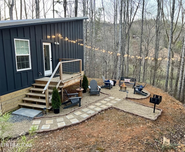 exterior space featuring a patio area and a fire pit