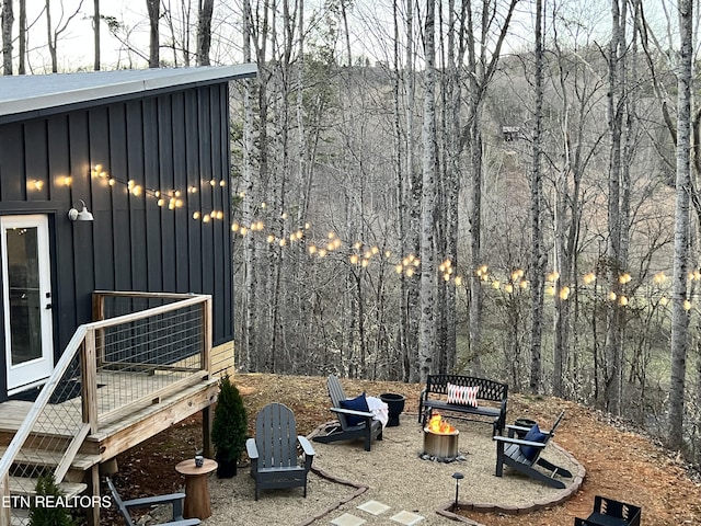 exterior space with a fire pit and a patio