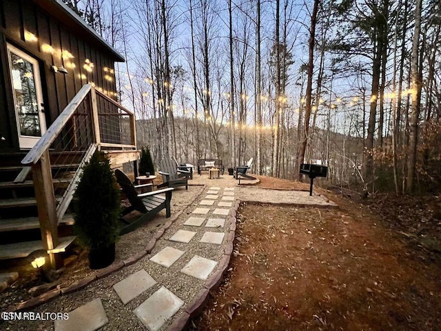 view of yard with a fire pit