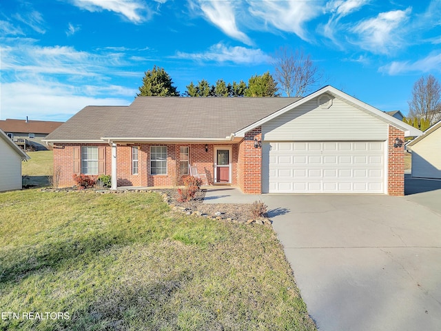 ranch-style house with driveway, brick siding, an attached garage, and a front yard