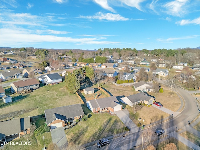 birds eye view of property with a residential view