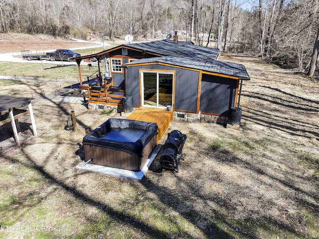 exterior space featuring a hot tub