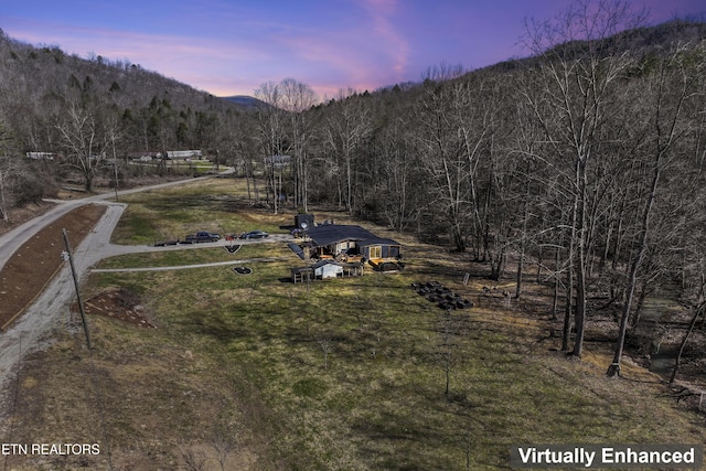 mountain view featuring a rural view and a wooded view