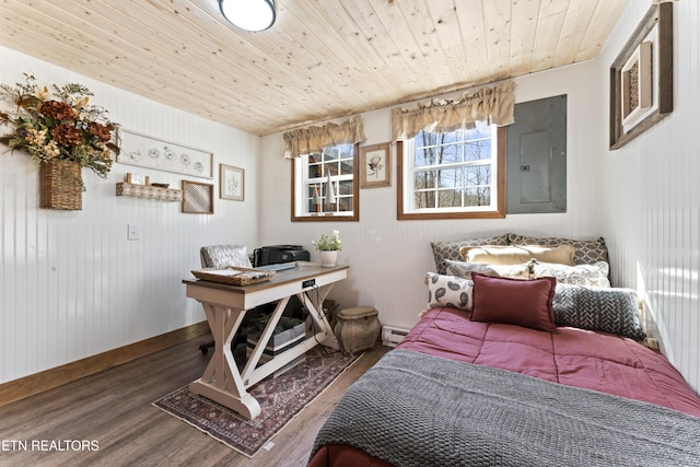 bedroom with wooden ceiling, electric panel, baseboard heating, and wood finished floors