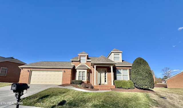 view of front of house featuring concrete driveway, brick siding, an attached garage, and a front yard