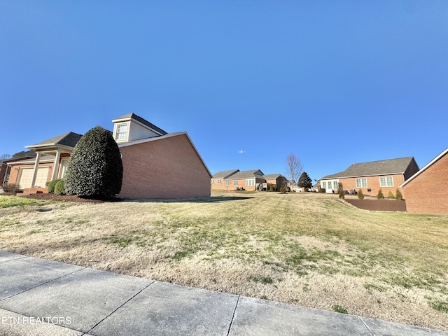 view of yard with a residential view