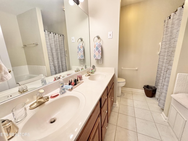 full bathroom featuring a sink, double vanity, tile patterned flooring, and baseboards