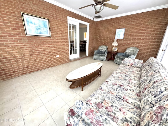 unfurnished living room featuring brick wall, tile patterned floors, a ceiling fan, and crown molding