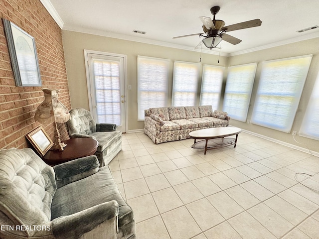 living room featuring brick wall, visible vents, and crown molding