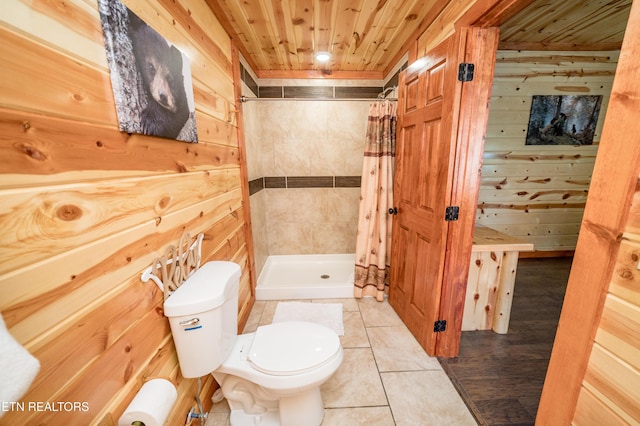 bathroom with toilet, wood walls, and wood ceiling