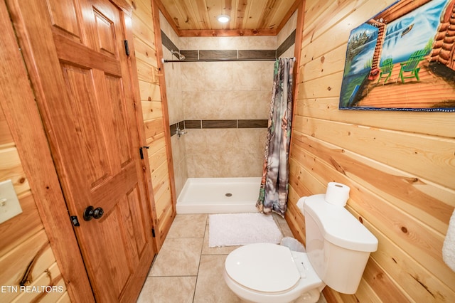 bathroom with wooden ceiling, toilet, wooden walls, tile patterned floors, and a stall shower