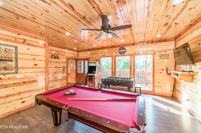 rec room with ceiling fan, wooden ceiling, wood finished floors, and wooden walls