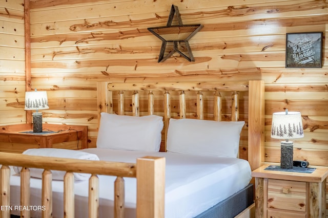 bedroom with wooden walls