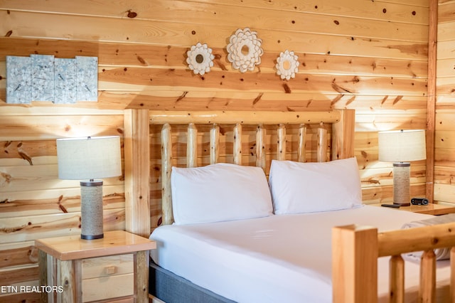 bedroom with wooden walls