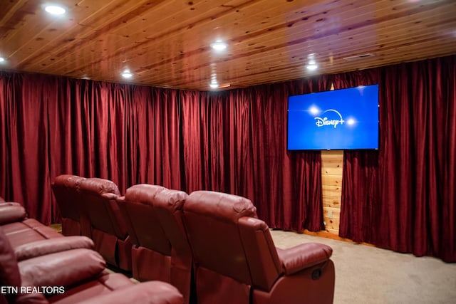 carpeted home theater room with wood ceiling, wooden walls, and recessed lighting