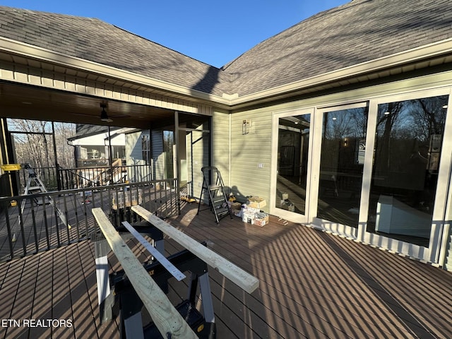 wooden deck featuring ceiling fan