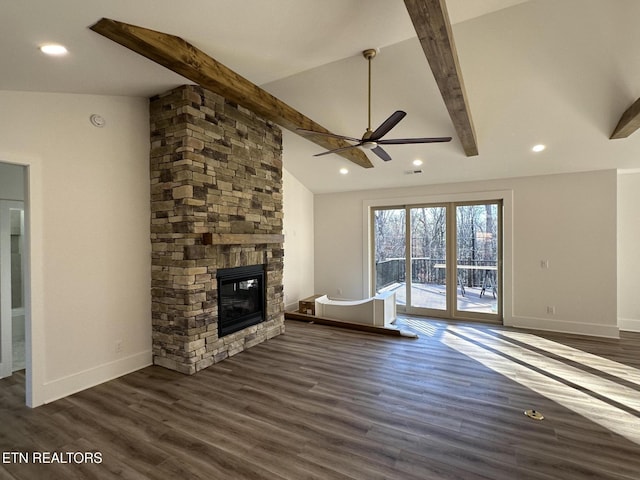 unfurnished living room with vaulted ceiling with beams, dark wood-type flooring, a fireplace, and baseboards