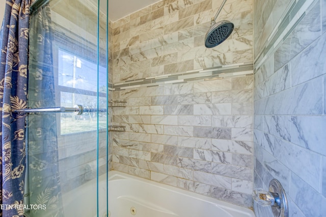 full bathroom with shower / bath combination with glass door