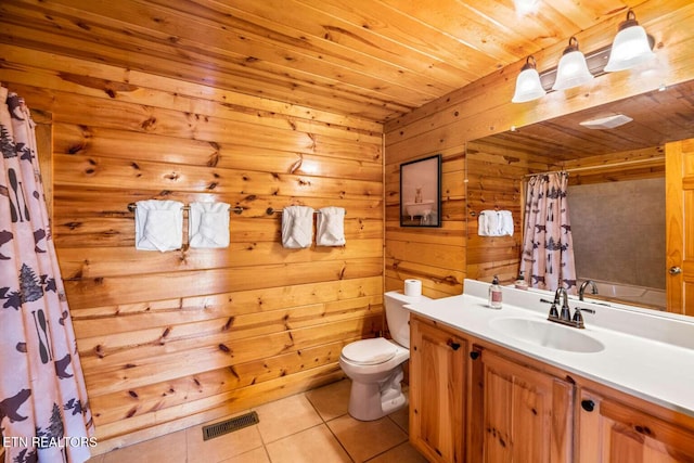 full bath with curtained shower, toilet, vanity, visible vents, and tile patterned floors