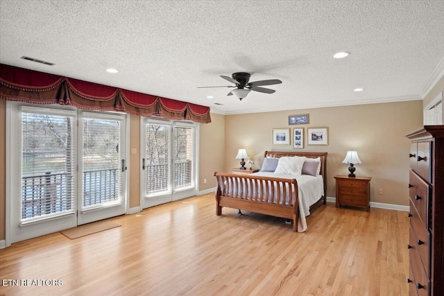 bedroom with visible vents, baseboards, access to outside, light wood finished floors, and crown molding