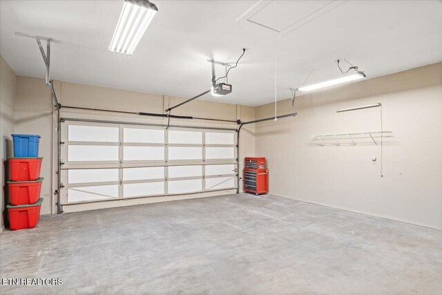 garage featuring a garage door opener