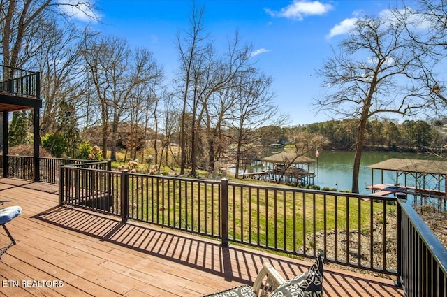 wooden terrace featuring a water view and a dock