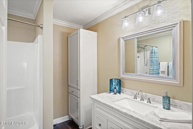 full bathroom featuring a shower with curtain, tile patterned floors, ornamental molding, and vanity