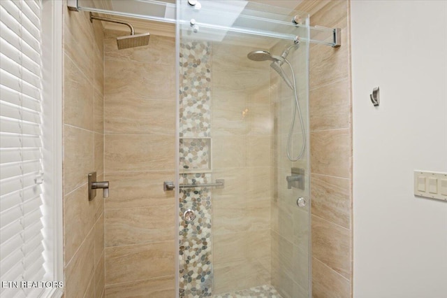 bathroom with a shower stall