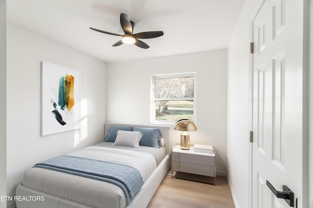 2247 W Gilbert Ln, Knoxville, TN 37920 - bedroom with light wood-style flooring, baseboards, and a ceiling fan