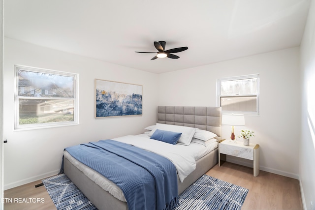 2247 W Gilbert Ln, Knoxville, TN 37920 - bedroom with wood finished floors, baseboards, and a ceiling fan