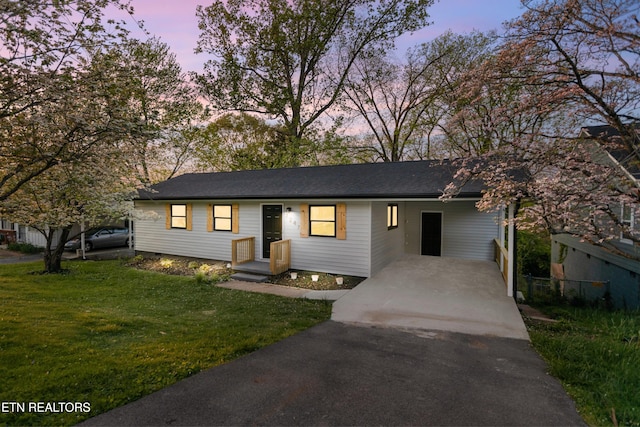 2247 W Gilbert Ln, Knoxville, TN 37920 - ranch-style house featuring driveway, a lawn, and an attached carport
