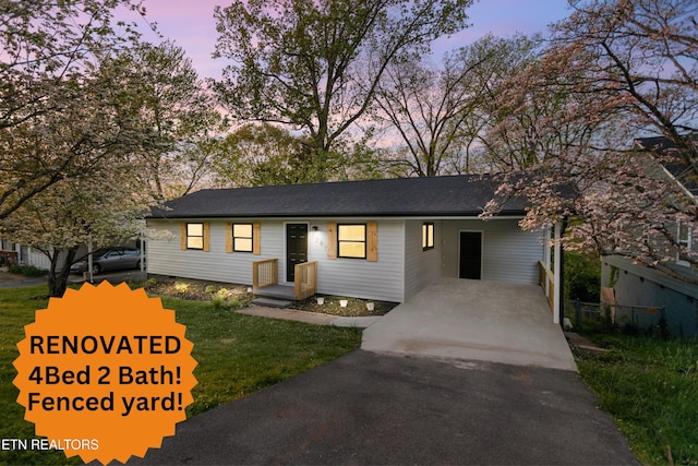 2247 W Gilbert Ln, Knoxville, TN 37920 - ranch-style home with asphalt driveway and an attached carport