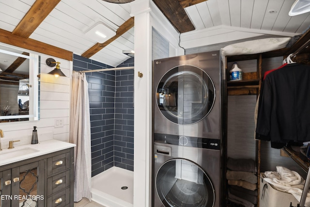 bathroom featuring stacked washer / dryer, wood ceiling, vaulted ceiling with beams, and a shower stall